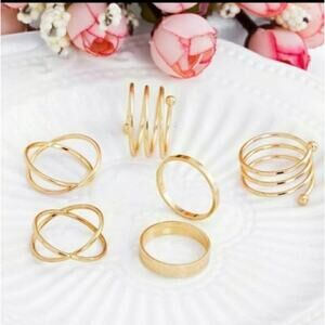 Set of 6 gold colored wrapped midi rings